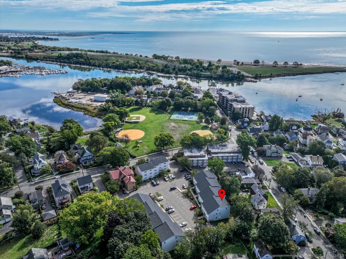 65 Ellsworth Street, Unit 302 Bridgeport, CT 06605 - Photo 3 of 40 an aerial view of lake and residential houses with outdoor space