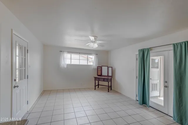 a view of room with window and hardwood floor