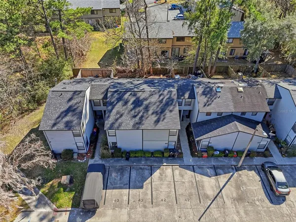 a view of a house with backyard and patio