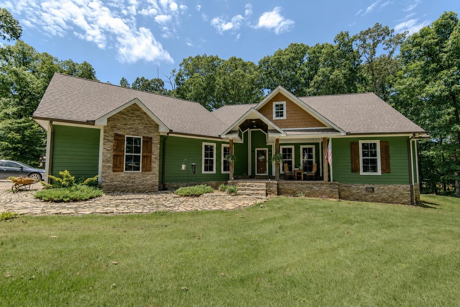 2134 Otis Plunk Road Bethel Springs, TN 38315 - Photo 1 of 35 a front view of a house with a garden and yard