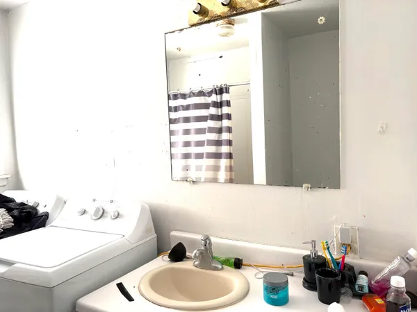 a bathroom with a sink and a mirror