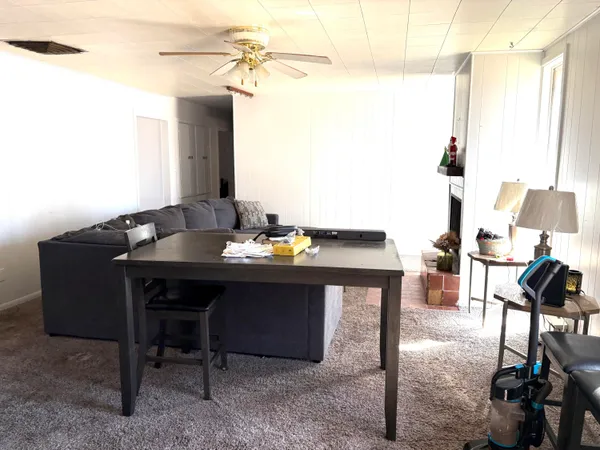 a view of a workspace with furniture