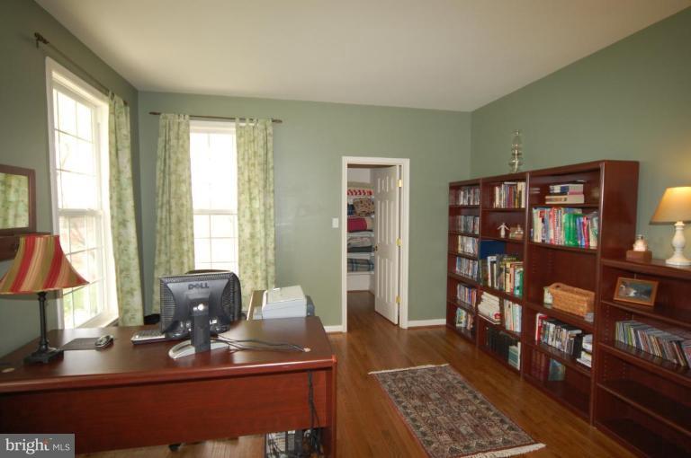 7791 Dollyhyde Road Mount Airy, MD 21771 - Photo 2 of 16 a view of a workspace with furniture and a window