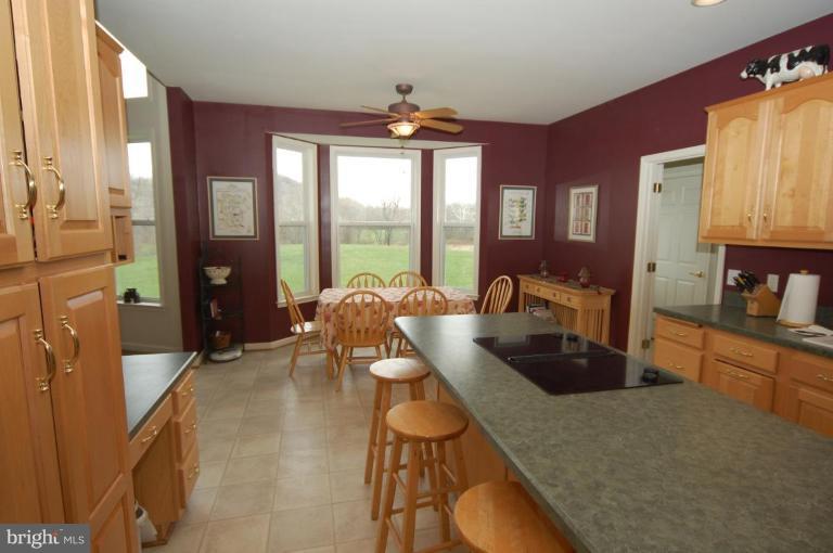 7791 Dollyhyde Road Mount Airy, MD 21771 - Photo 6 of 16 a living room with furniture and a large window