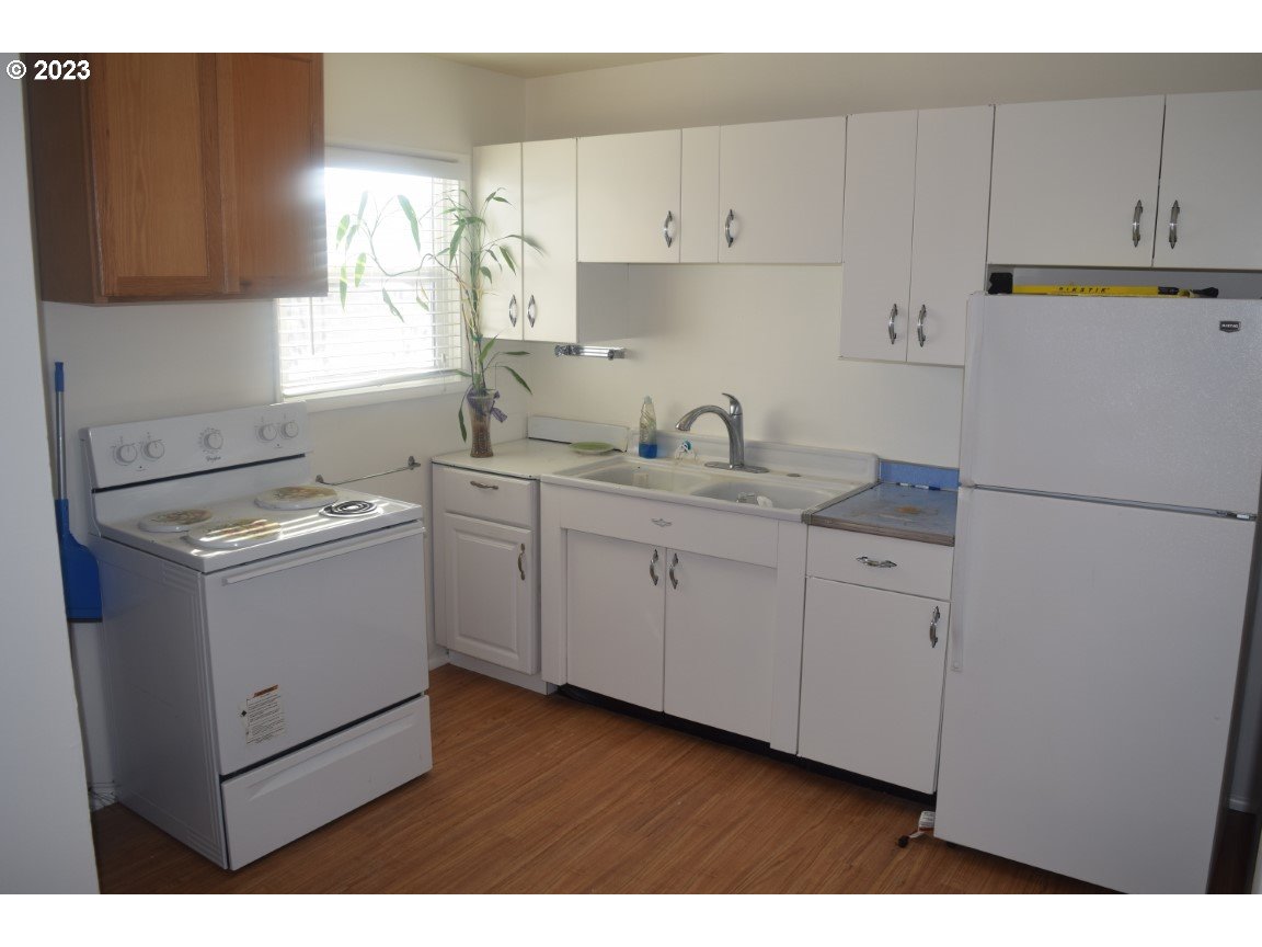 736 Southwest 28th Street Pendleton, OR 97801 - Photo 8 of 14 a kitchen with a sink dishwasher and white cabinets