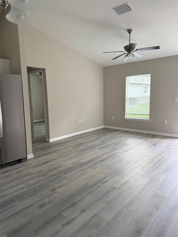 9543 North Travis Drive, Unit A Citrus Springs, FL 34434 - Photo 6 of 15 wooden floor in an empty room with a window