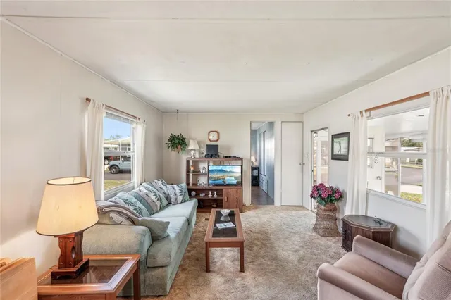 a living room with furniture and a table