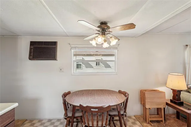 a dining room with furniture and window