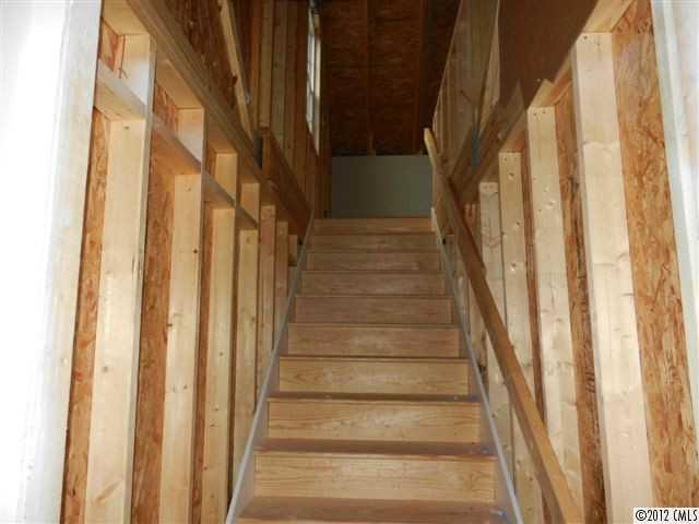 7595 Woodleaf Road Woodleaf, NC 27054 - Photo 15 of 16 a view of staircase with lots of door