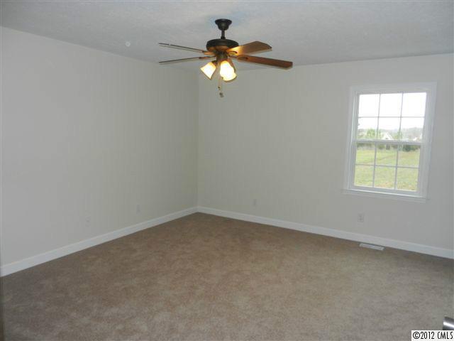 7595 Woodleaf Road Woodleaf, NC 27054 - Photo 10 of 16 an empty room with a window