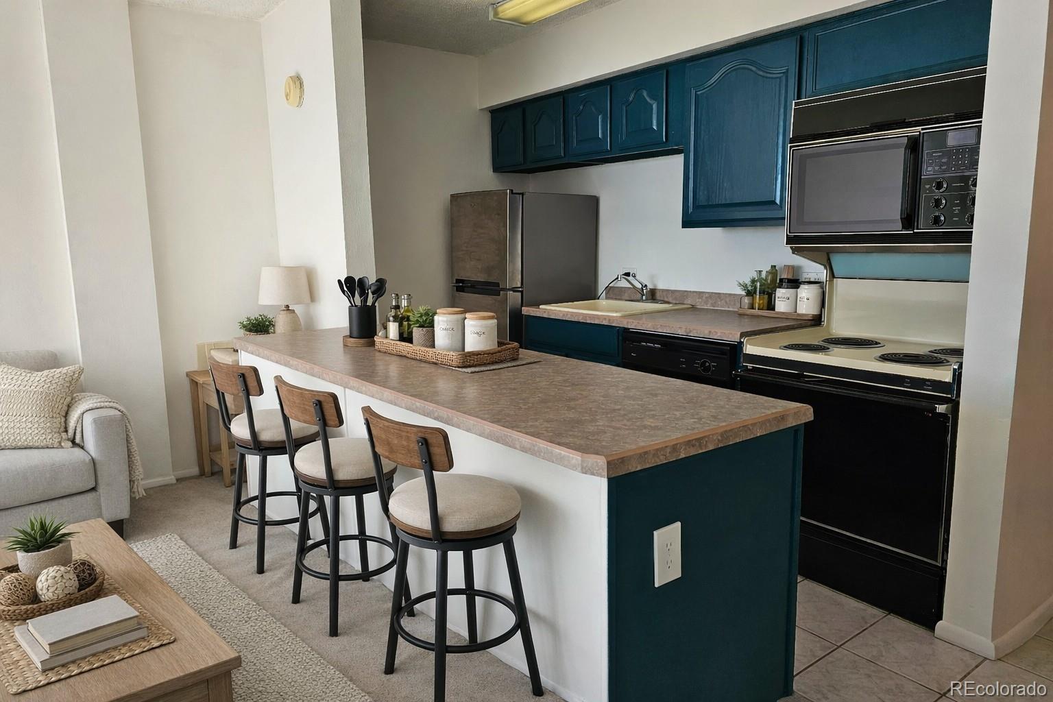 1020 15th Street, Unit 33B Denver, CO 80202 - Photo 13 of 48 a kitchen with a kitchen island hardwood floor and a sink