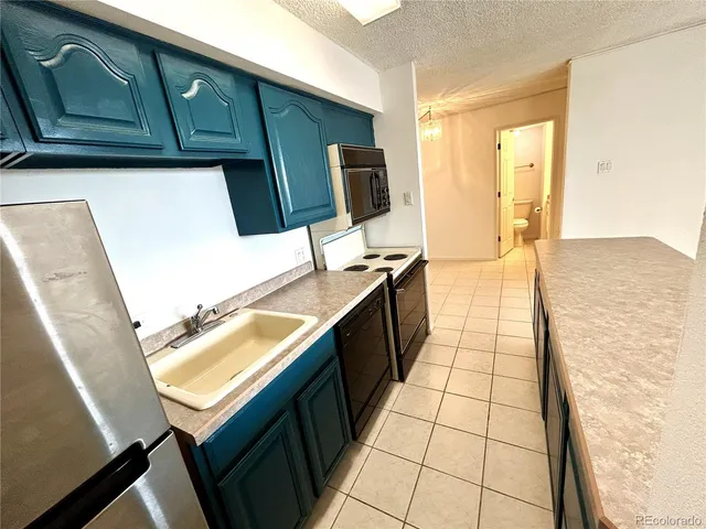 a view of a livingroom with an empty space and a window