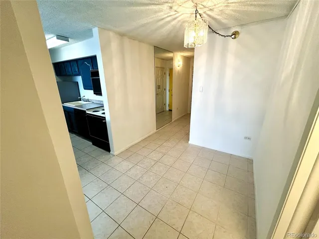 a bathroom with a granite countertop toilet sink and a mirror