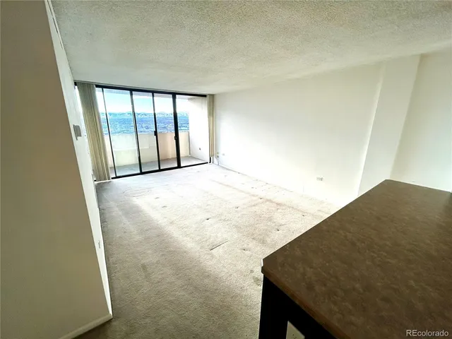 a view of an empty room and window