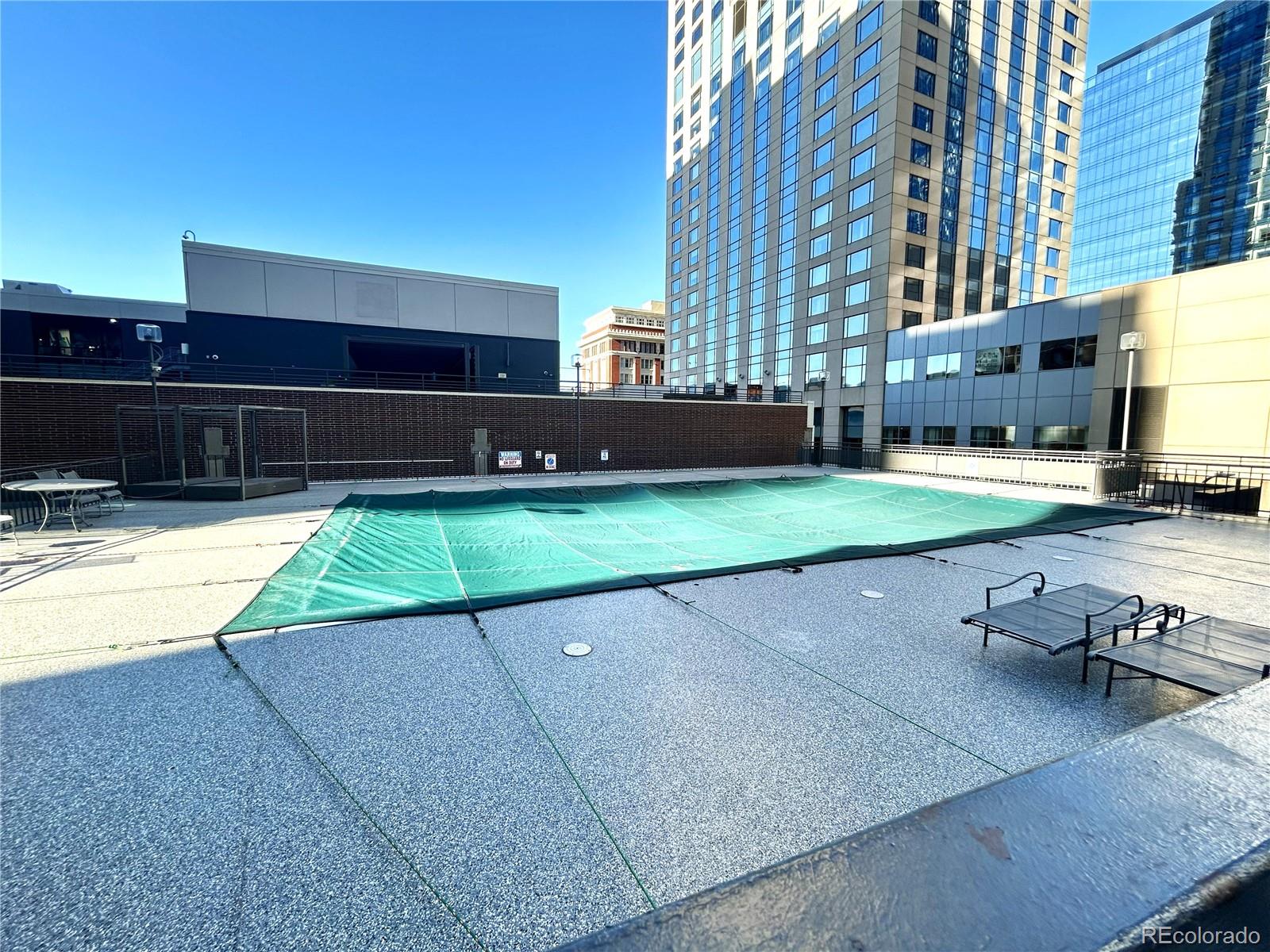 1020 15th Street, Unit 33B Denver, CO 80202 - Photo 33 of 48 a view of a swimming pool with a yard