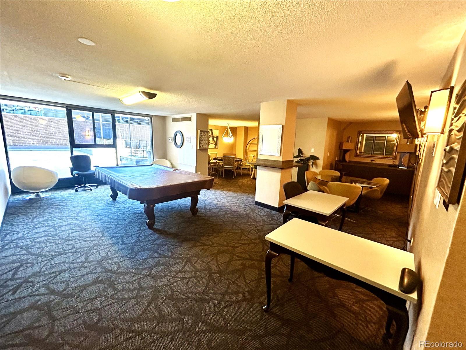 1020 15th Street, Unit 33B Denver, CO 80202 - Photo 35 of 48 a living room with furniture and a large window