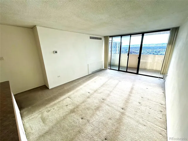 an empty room with large window