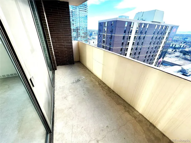 a view of balcony with a floor to ceiling window