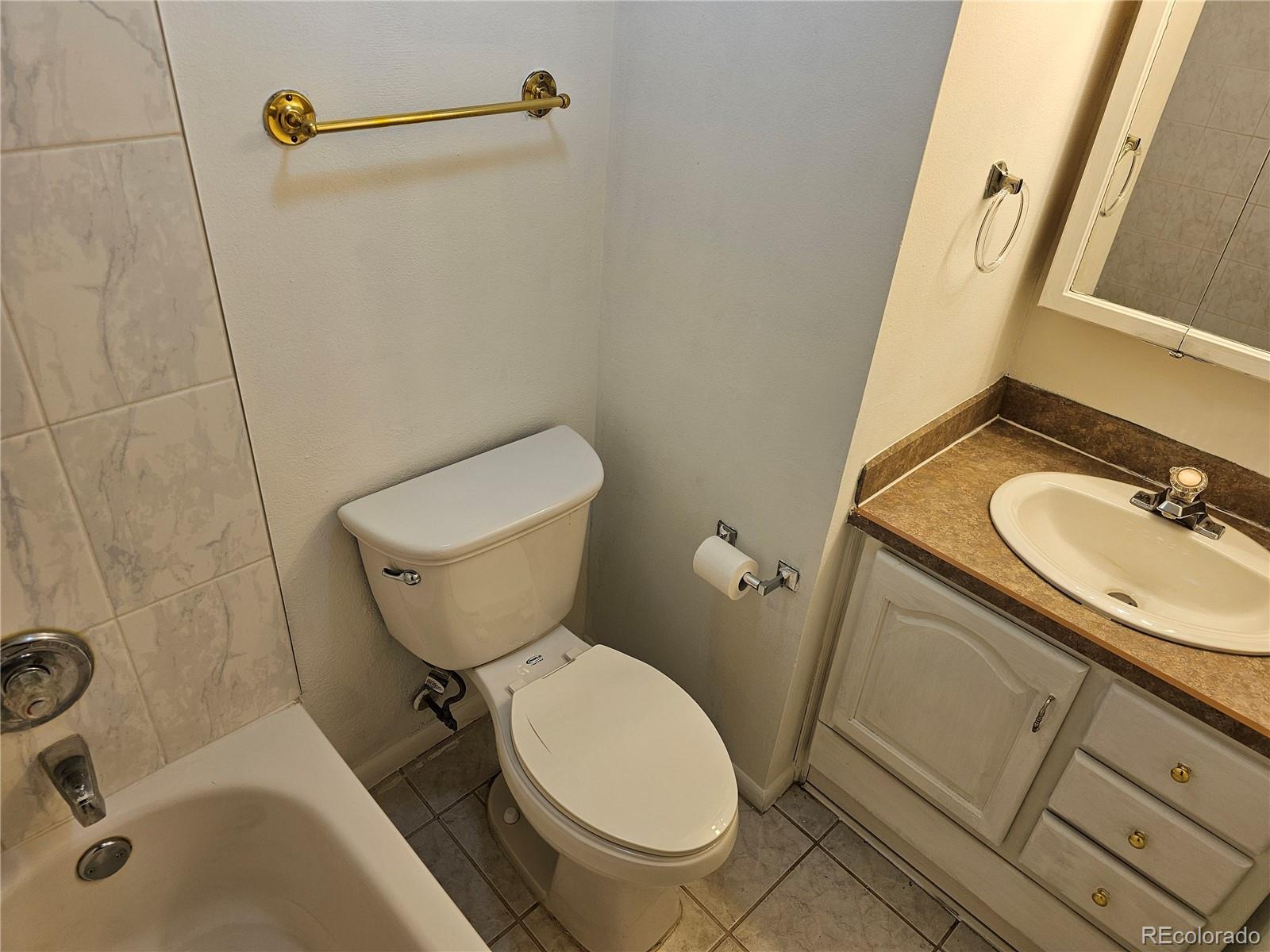 1020 15th Street, Unit 33B Denver, CO 80202 - Photo 8 of 48 a bathroom with a sink toilet and shower