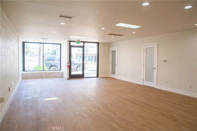 a view of an empty room and a window