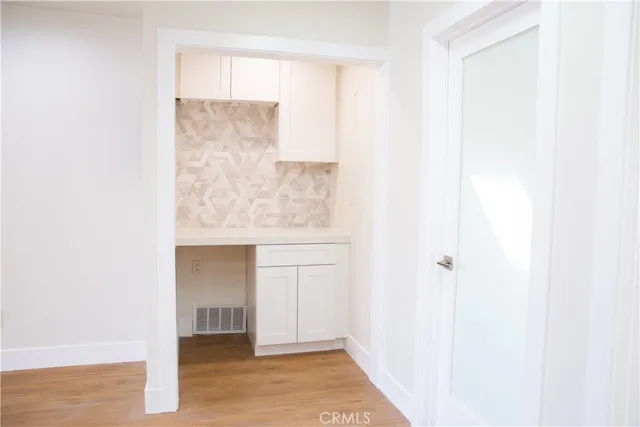 a living room filled with furniture and a window
