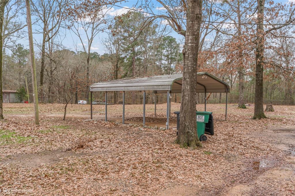 158 Edwards Road Doyline, LA 71023 - Photo 22 of 28 a backyard of a house with lots of green space