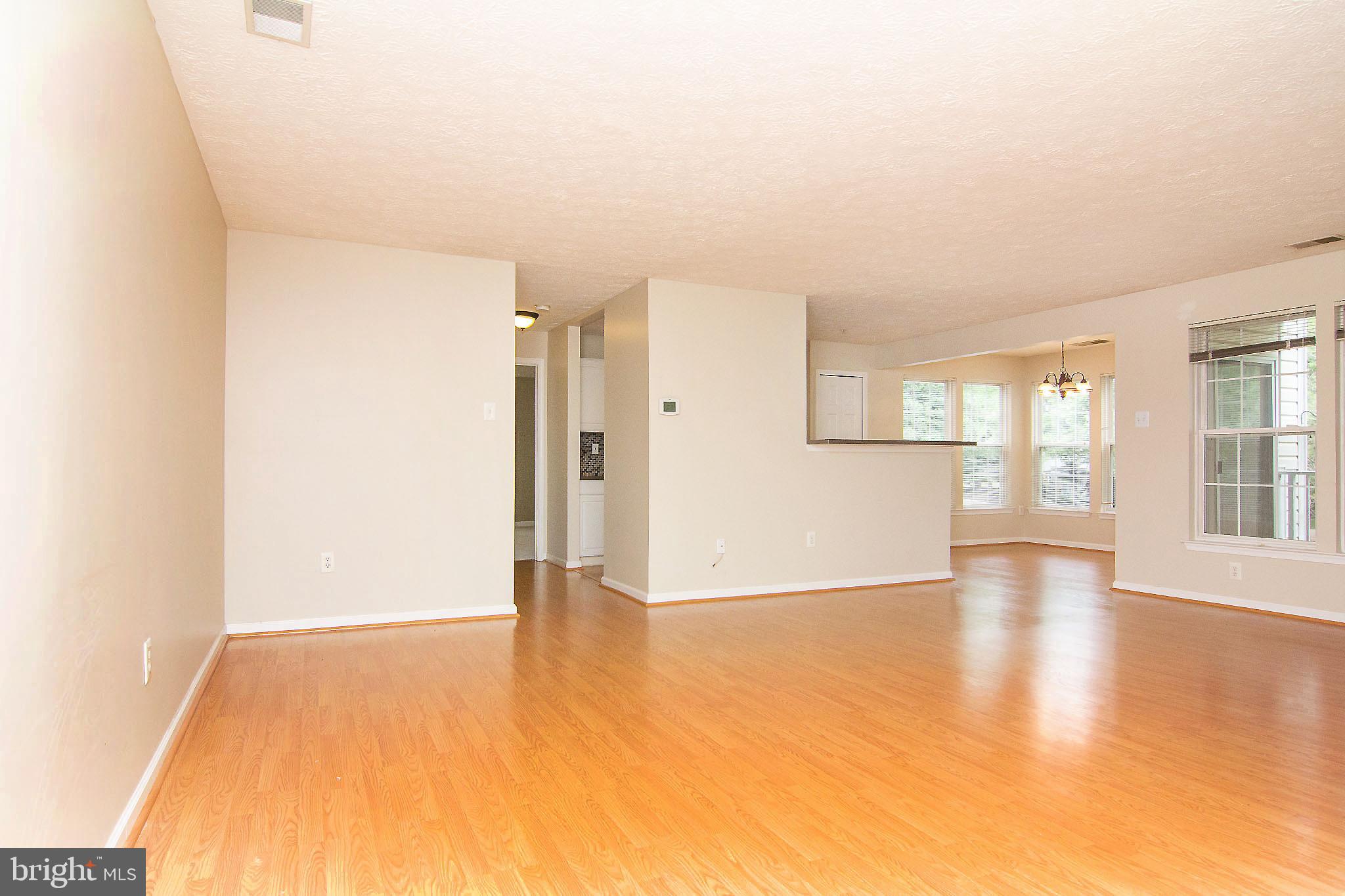 4823 Shellbark Road, Unit 4823 Owings Mills, MD 21117 - Photo 31 of 31 open floor plan, kit, dining, primary br, beyond