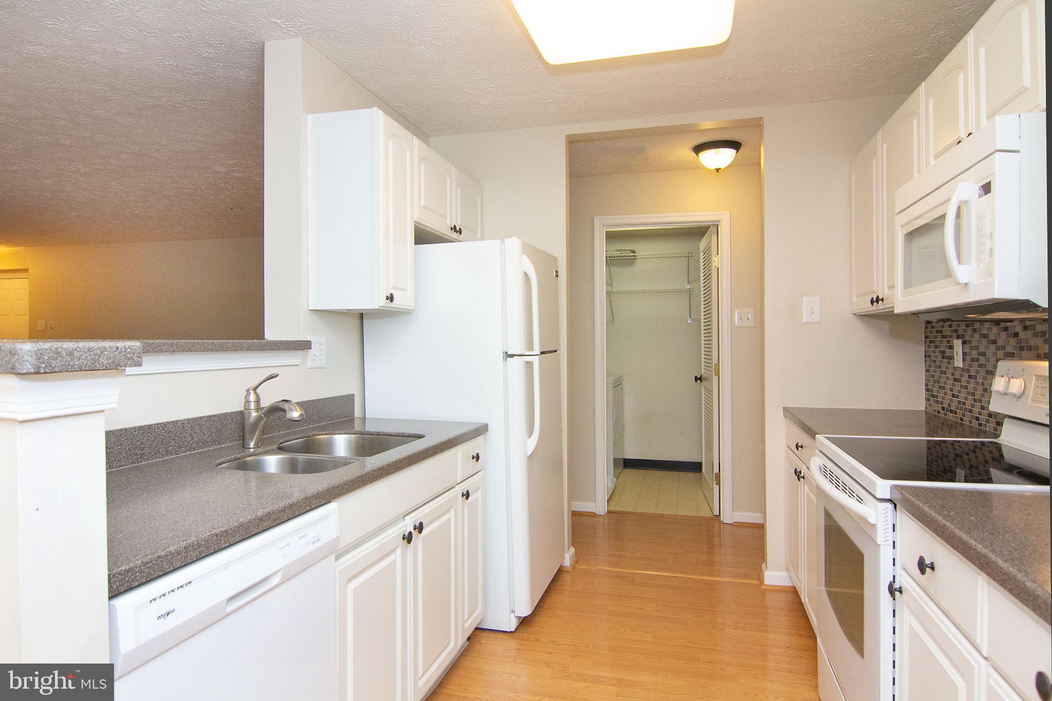 4823 Shellbark Road, Unit 4823 Owings Mills, MD 21117 - Photo 18 of 31 Kitchen, laundry beyond