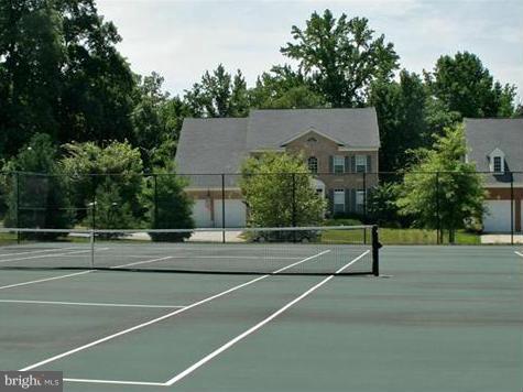 2433 Baileys Pond Road Accokeek, MD 20607 - Photo 7 of 18 a view of a house with a basketball court