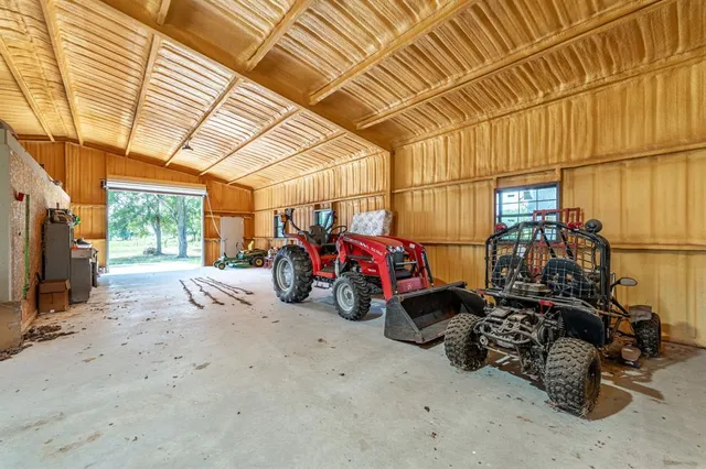 a view of a garage with furniture and a garage