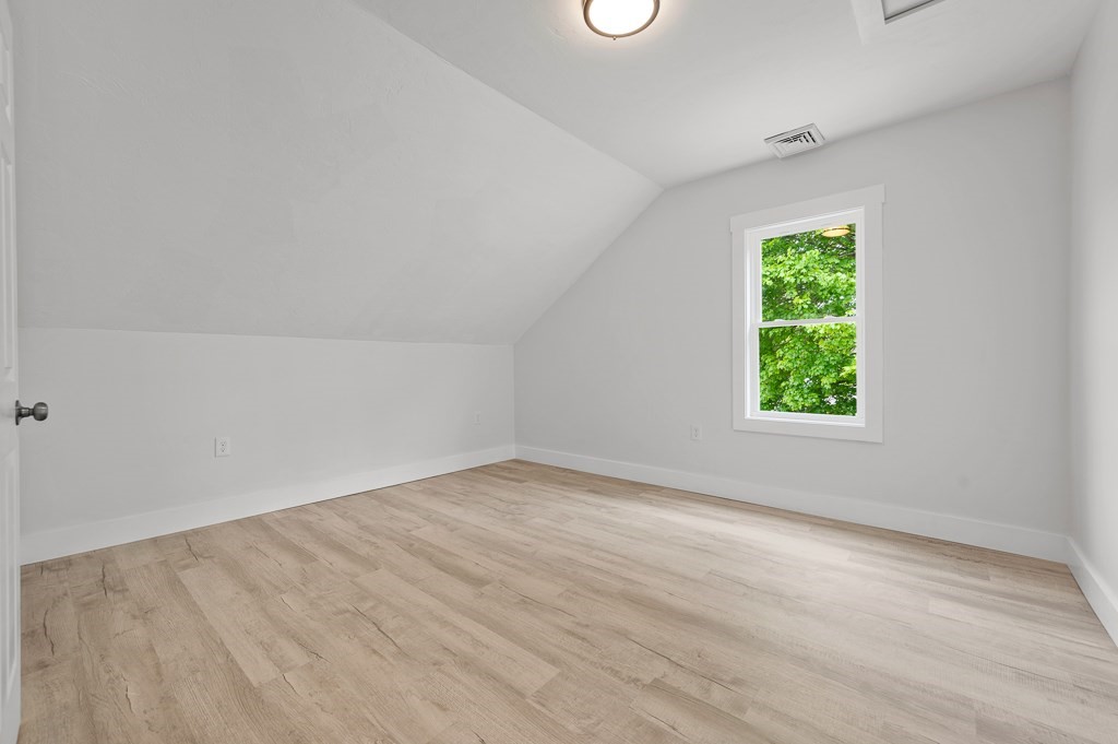 91 Schofield Avenue Dudley, MA 01571 - Photo 12 of 27 an empty room with a window