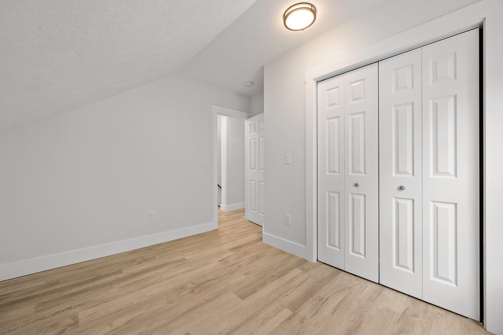 91 Schofield Avenue Dudley, MA 01571 - Photo 15 of 27 a view of a livingroom with wooden floor