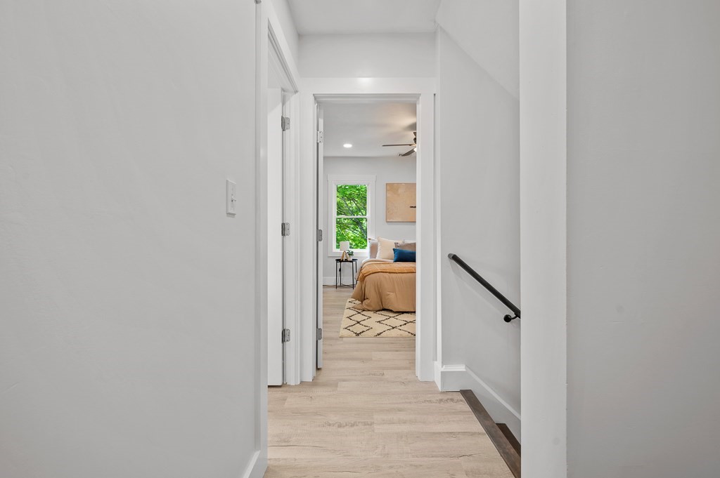 91 Schofield Avenue Dudley, MA 01571 - Photo 16 of 27 a view of a hallway with a couch