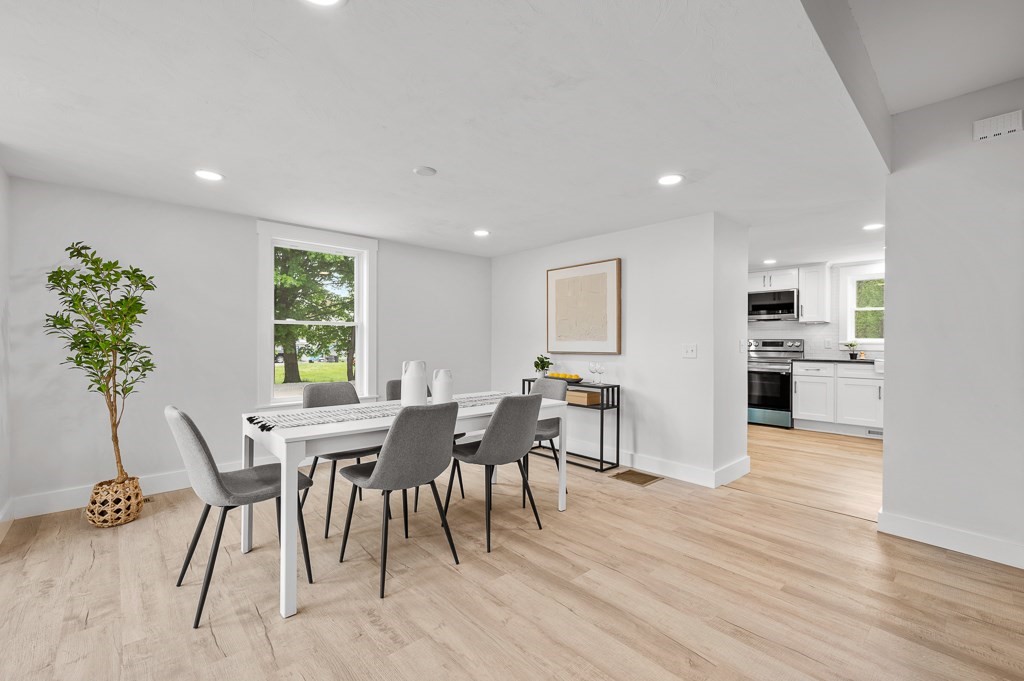 91 Schofield Avenue Dudley, MA 01571 - Photo 2 of 27 a view of a dining room with furniture and wooden floor