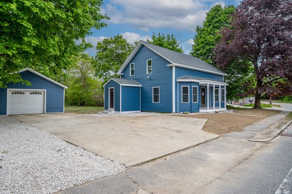 91 Schofield Avenue Dudley, MA 01571 - Photo 22 of 27 a house with a tree in front of it