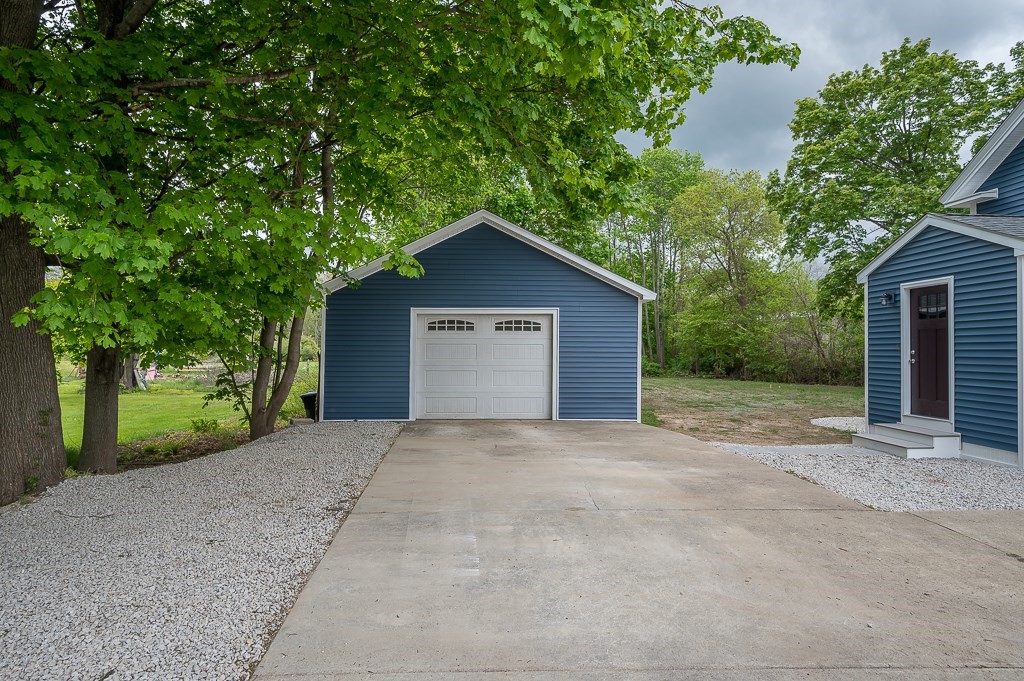91 Schofield Avenue Dudley, MA 01571 - Photo 23 of 27 a view of a house with a yard and large tree