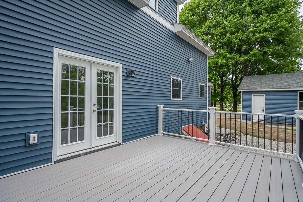 91 Schofield Avenue Dudley, MA 01571 - Photo 24 of 27 a front view of a house with a yard