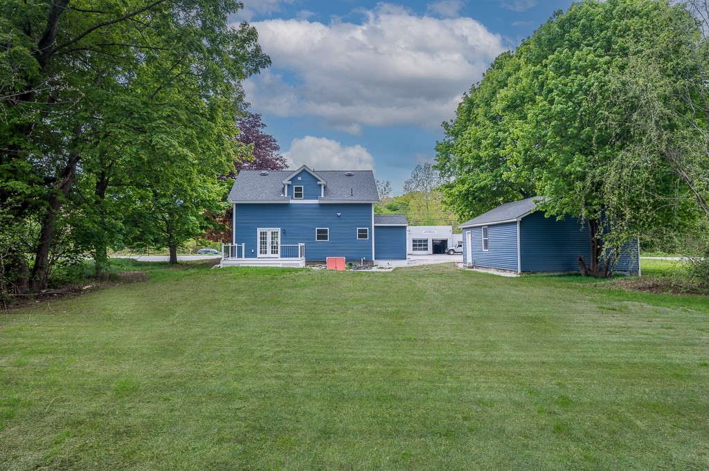 91 Schofield Avenue Dudley, MA 01571 - Photo 25 of 27 a view of a house with a big yard