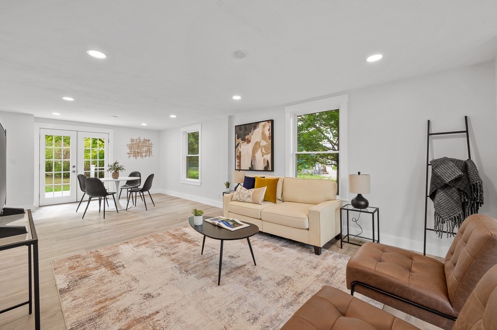 91 Schofield Avenue Dudley, MA 01571 - Photo 4 of 27 a living room with furniture and a large window