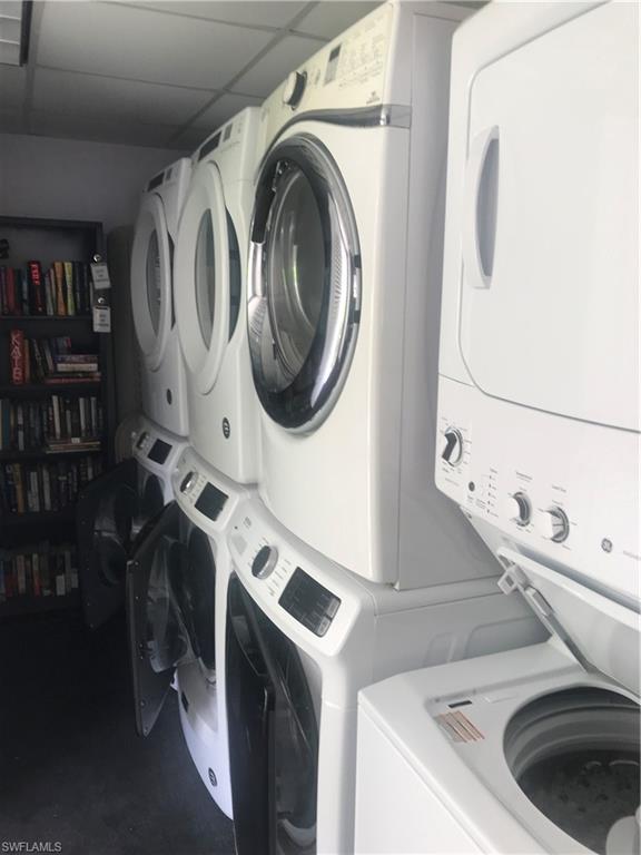 216 Banyan Boulevard, Unit 216 Naples, FL 34102 - Photo 11 of 33 a utility room with dryer and washer