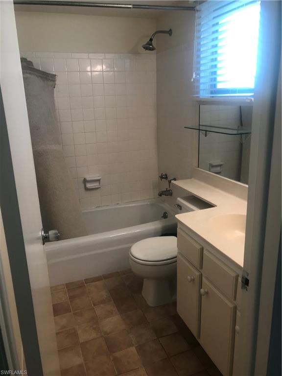 216 Banyan Boulevard, Unit 216 Naples, FL 34102 - Photo 19 of 33 a bathroom with a sink a toilet and shower