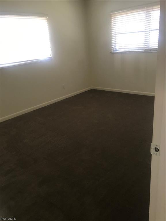 216 Banyan Boulevard, Unit 216 Naples, FL 34102 - Photo 22 of 33 an empty room with a window