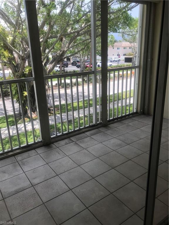 216 Banyan Boulevard, Unit 216 Naples, FL 34102 - Photo 26 of 33 a view of a black and white fence