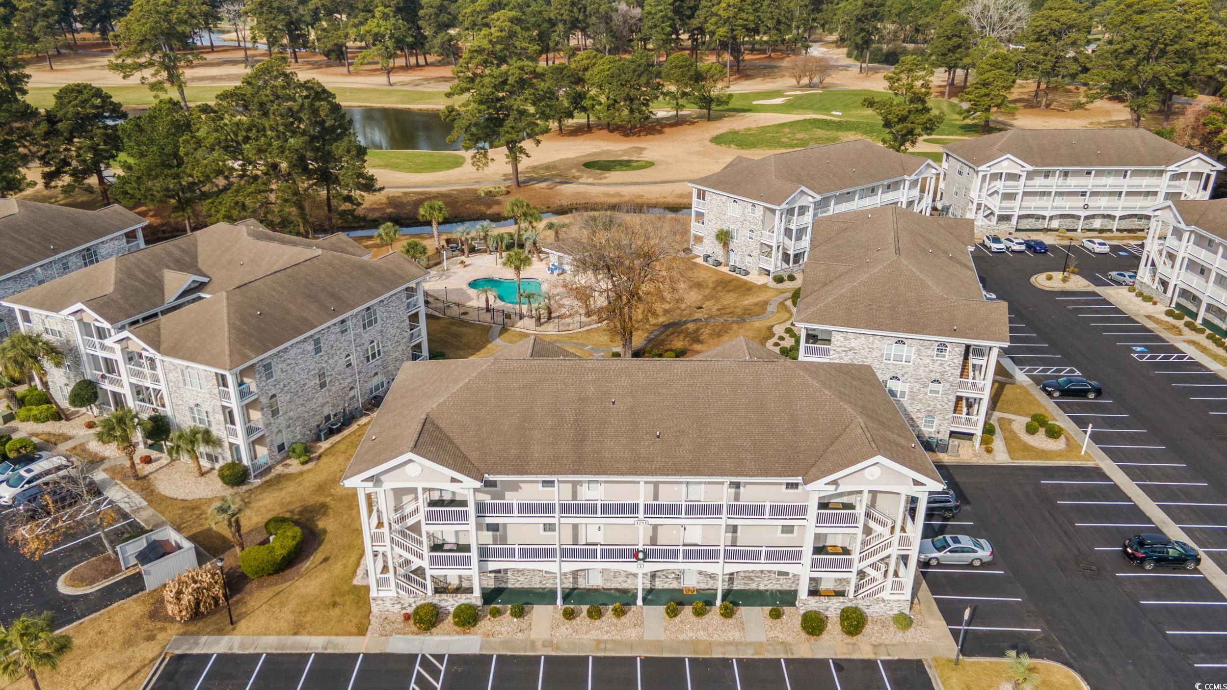 4781 Wild Iris Drive, Unit 301 Myrtle Beach, SC 29577 - Photo 29 of 33 Bird's eye view of a tree filled landscape