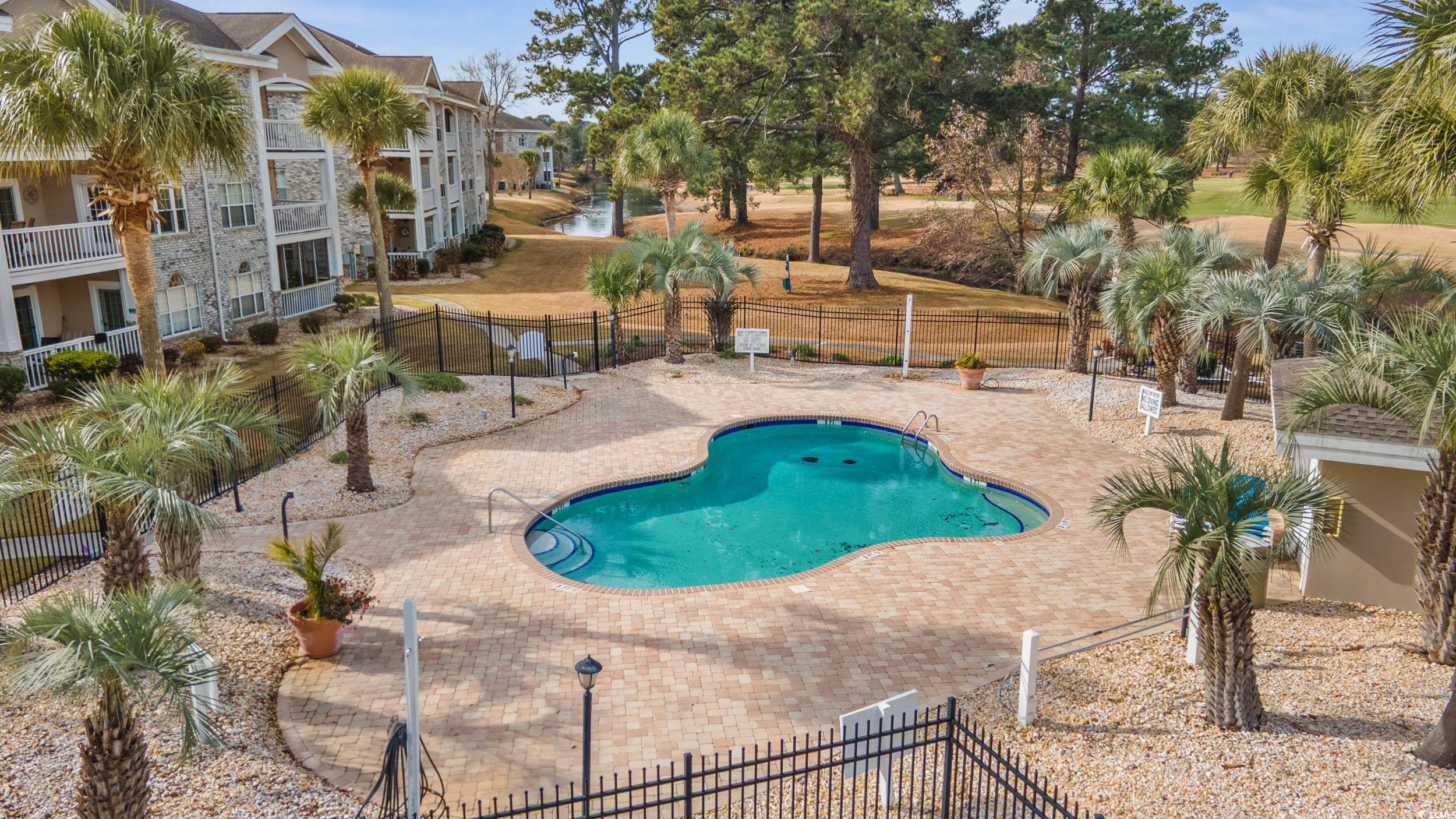 4781 Wild Iris Drive, Unit 301 Myrtle Beach, SC 29577 - Photo 32 of 33 View of apartment building / complex with uncovered parking