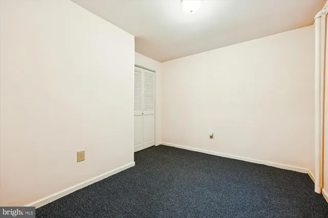 a bathroom with a sink mirror and toilet