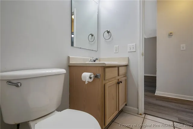 a bathroom with a toilet sink and shower