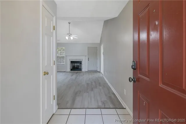 wooden floor in an empty room with a fireplace