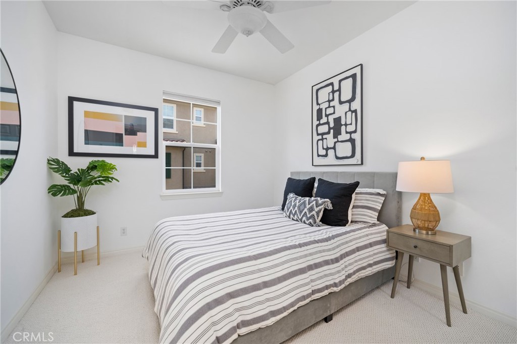 322 Dewdrop Irvine, CA 92603 - Photo 14 of 26 a bedroom with a bed and a potted plant