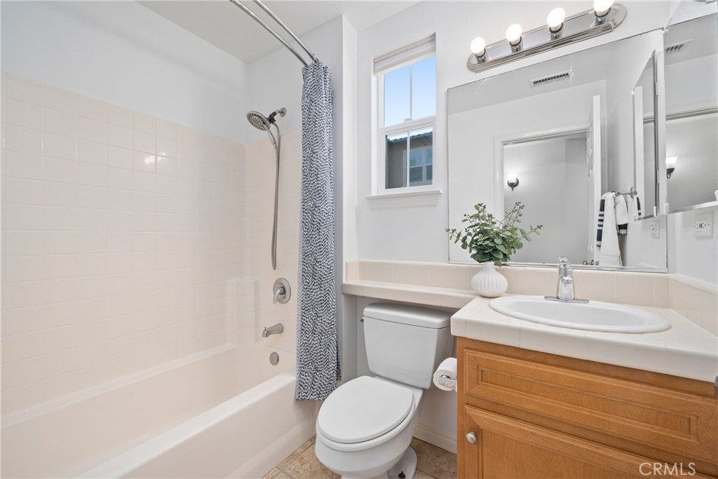 322 Dewdrop Irvine, CA 92603 - Photo 16 of 26 a bathroom with a sink toilet and shower